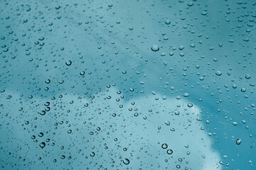 Rain drops on window pane glass surface