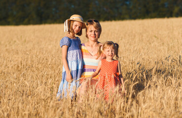 woman with two daughters in field