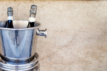 two bottles of champagne in the bucket copy space