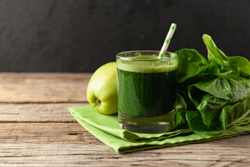Healthy green smoothie on vintage wooden table. Fresh detox nutrient.