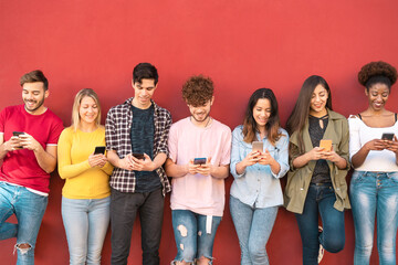 Group young friends using mobile smartphone outdoor - Millennial generation having fun with new...