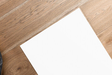 Multipurpose blank A4 format letterhead on wooden desk