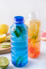 Isotonic fortified drinks on a white background. Vertical photo