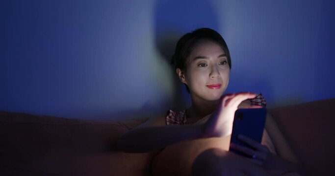 Woman use of cellphone at night
