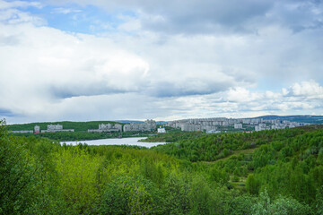 Natural landscape with city views on the horizon.