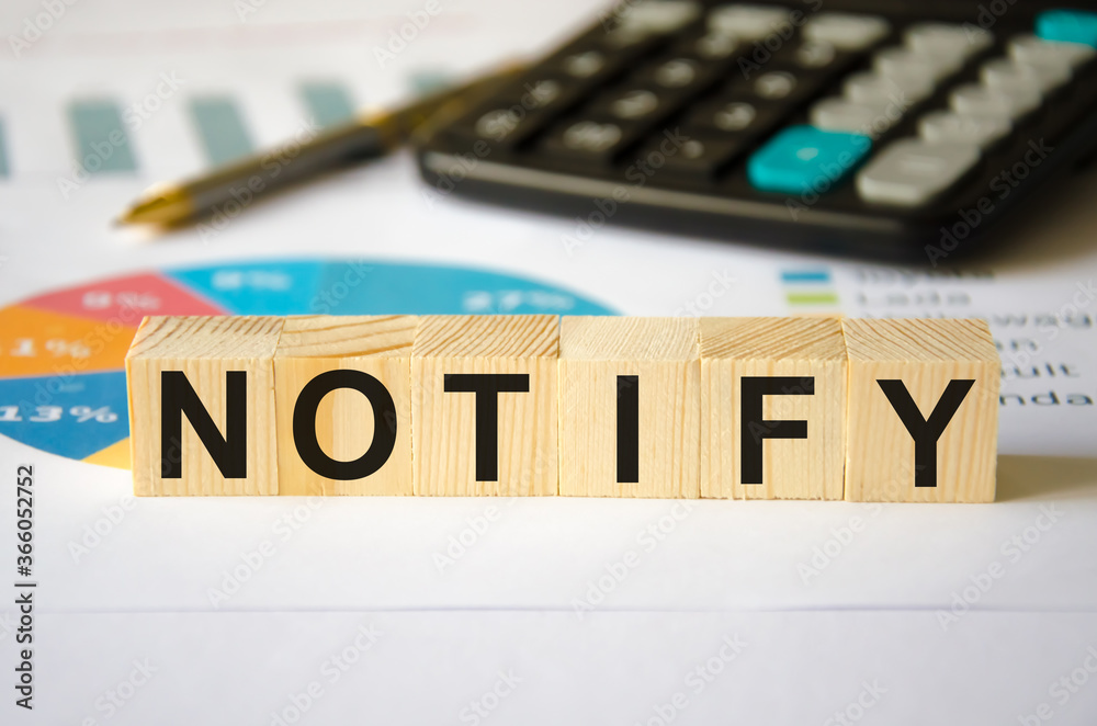 Fototapete text notify written on a blue background near a magnifying glass and and a calculator