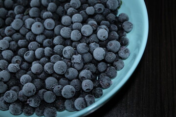 frozen blackberry on blue plate