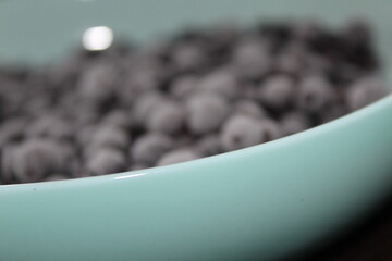 frozen blackberry on blue plate