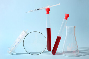 Test tubes with blood and laboratory glassware