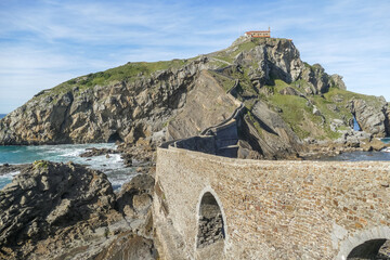 Fototapeta premium House standing on an island, gaztelugatxe peyredragon, pays basque