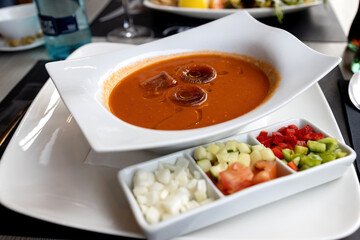 Refreshing cold summer gazpacho on the table in a Spanish restaurant