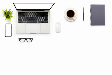 Flat lay of White office desk table or workplace with laptop, and smartphone with equipment other office supplies with copy space and white blank screen, top view