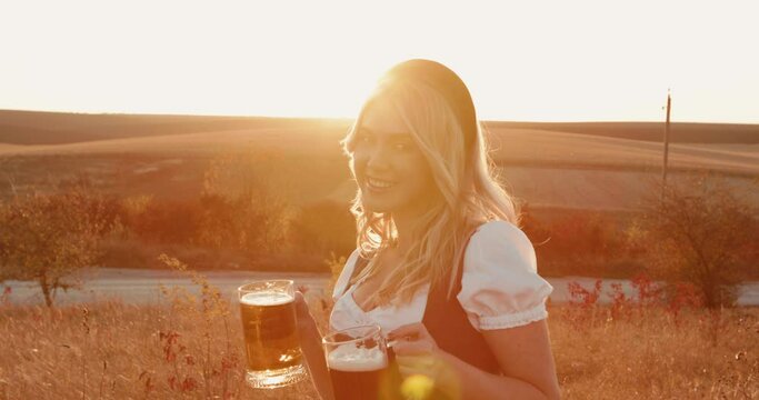 Portrait of playful, Slavic girl flirts with camera and cheers two pints of beer