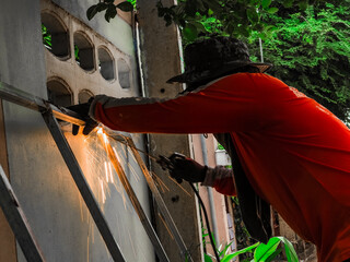welder connects metal parts to complex structures using electric welding.Selective Focus