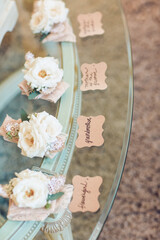 small pink and white rose groom boutonniere