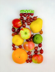 Fresh fruit in shape of jar on white background. Top view. Organic fruit. Food ingredients. Healthy eating concept