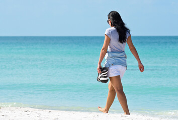 Mature Woman Walking on the Beach
