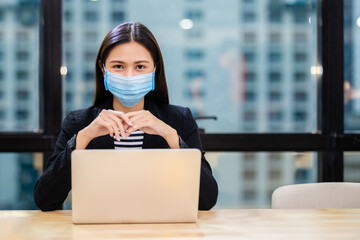 Asian women wear masks protect against airborne disease and salivary infections, during outbreak of...