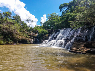 Fototapeta na wymiar Beautiful waterfall in Carrancas city, Brazil