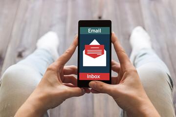 The woman received an e-mail online on a mobile phone. Message online icon.	