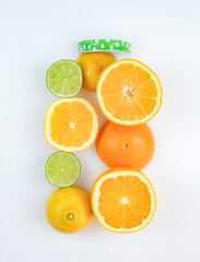 Fresh citrus fruit in shape of jar on white background. Top view. Healthy eating concept.