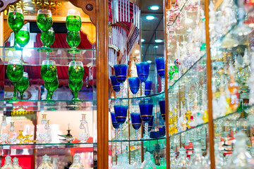 Shop showcase with handmade colorful wine glasses.