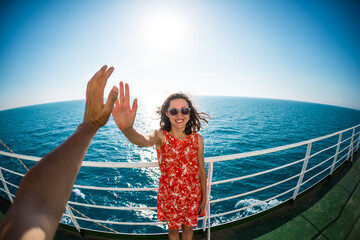 A woman is sailing on a cruise ship