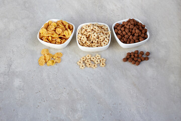 Breakfast cereals in bowls on a light background