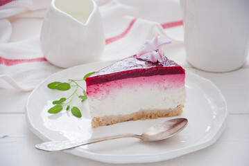 Berry cheesecake on a white wooden background