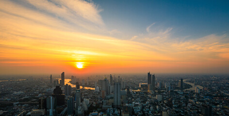 Obraz premium Aerial view of Bangkok City skyscrapers and blue sky the sunset background with King Power MahaNakhon viewpoint