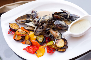 Delicious freshly cooked fresh mussels with sauce.