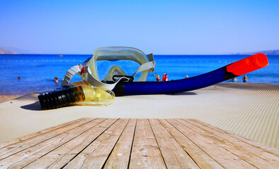 Morning at sandy beach of the Red Sea with mask and snorkel for diving, Middle East