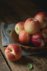 Ripe peaches on a wooden table
