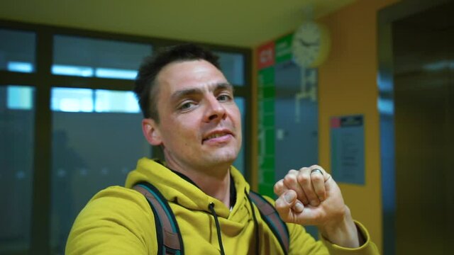 A man makes a video blog. Demonstration of life and online telling about life hacks in the administration. Blogosphere development in self-isolation.