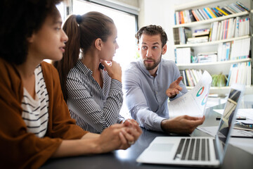 Programmers cooperating at IT company developing apps