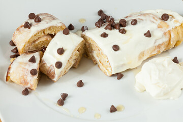Tasty And Healthy Breakfast; Pancakes Rolled Up With Dietary Chocolate Chips And Honey.