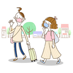 マスクをつけて旅行するふたりの若い女性