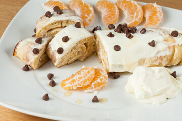 Tasty And Healthy Breakfast; Pancakes Rolled Up With Dietary Chocolate Chips And Honey.
