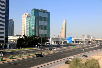 aerial view of highway road in Dubai with background of big modern building