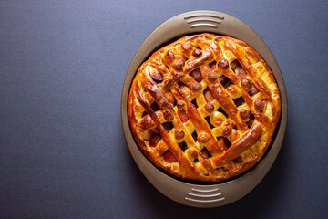 yeast pie with apples and cinnamon on the table
