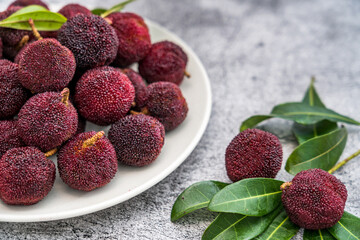  bowl of bayberry placed on a concrete table