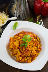 Rice and chicken breast cooked in tomato sauce.