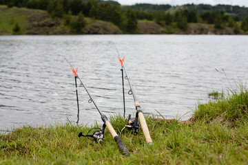 Obraz na płótnie Canvas Fishing rods by the river