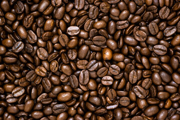 Top view of brown roasted coffee beans, can be use as background, copy space for text.