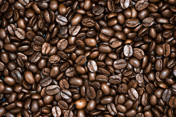 Top view of brown roasted coffee beans, can be use as background, copy space for text.