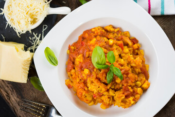 Rice and chicken breast cooked in tomato sauce.