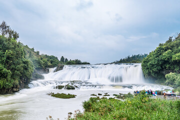 Naklejka premium Scenery of steep slope pond waterfall in Huangguoshu, Guizhou, China