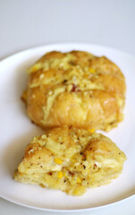 Korean garlic cheese bread on white background.