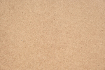 Texture of brown craft or kraft paper background, cardboard sheet, recycle paper, copy space for text.
