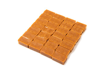 Tasty caramel candy isolated on white background.